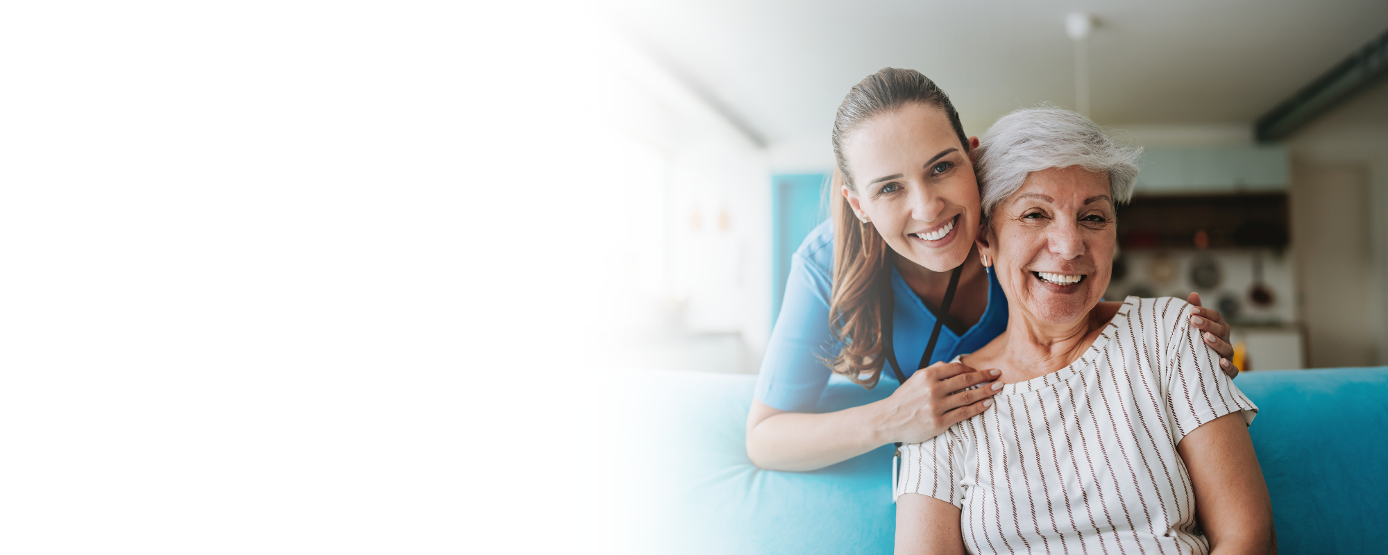 caregiver-hugging-senior-woman-on-sofa