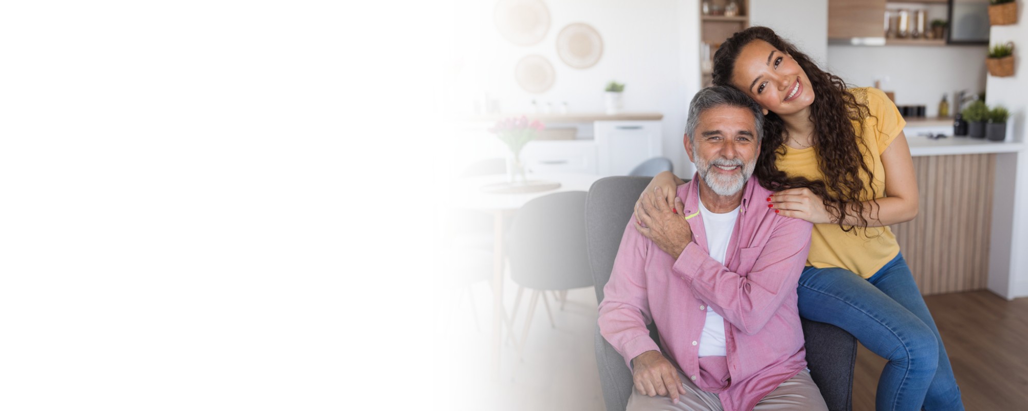 Adult daughter hugging senior father at home Adult daughter hugging senior father at home - About us